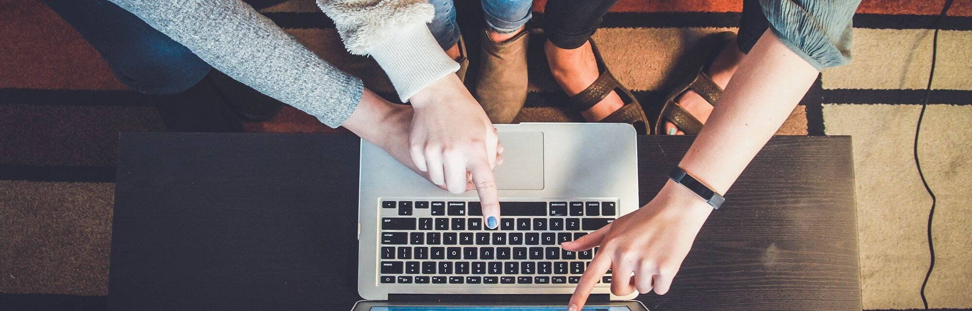 Person's hands working at laptop