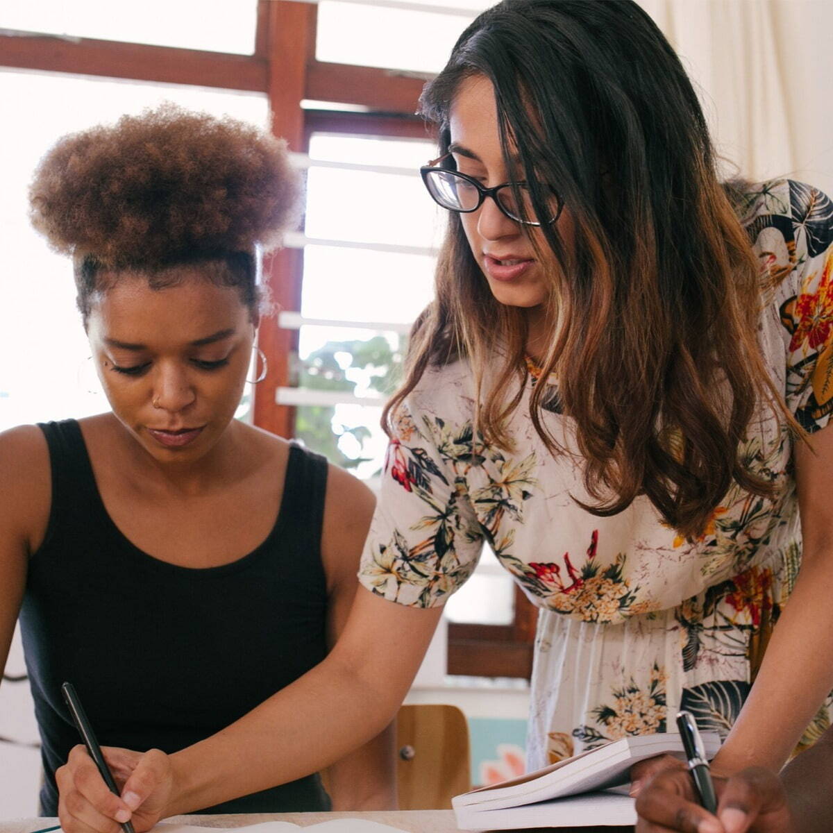 Two females working together